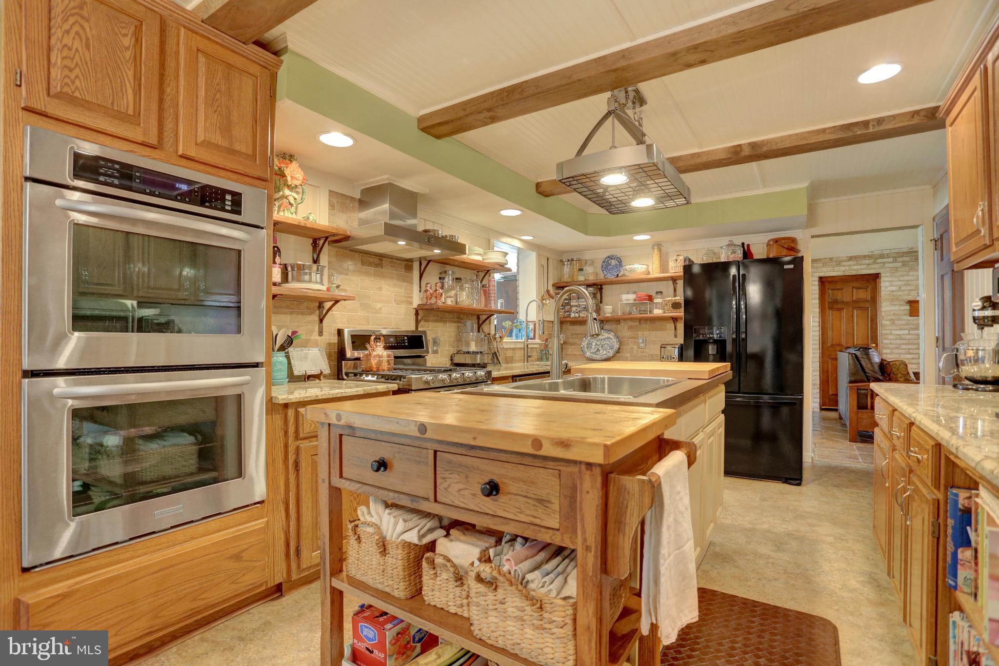 2301 Birch Road York, PA 17408 - Photo 16 of 40 a kitchen with a stove and a refrigerator
