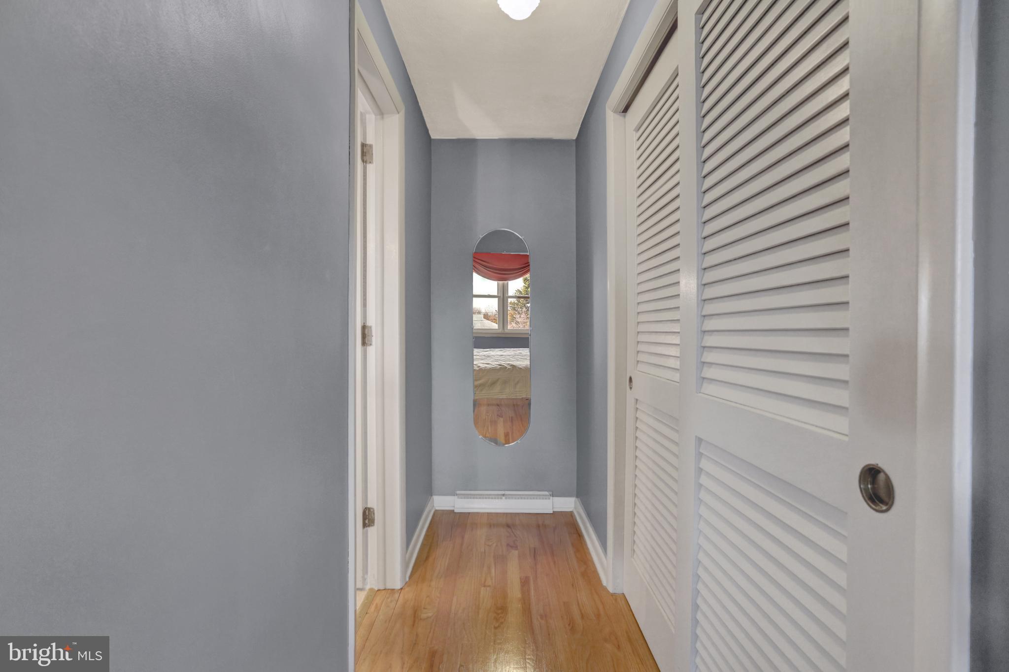 2301 Birch Road York, PA 17408 - Photo 23 of 40 a view of a hallway with wooden floor and staircase