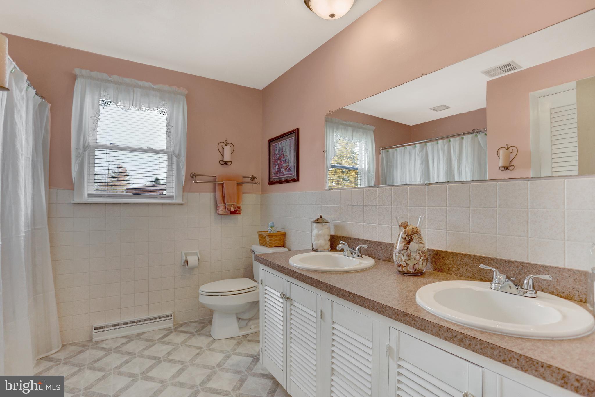 2301 Birch Road York, PA 17408 - Photo 27 of 40 a bathroom with a toilet a sink and a mirror