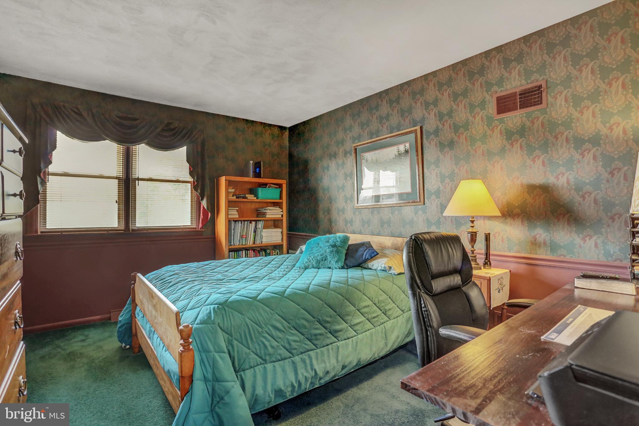 2301 Birch Road York, PA 17408 - Photo 28 of 40 a bedroom with a bed and dresser with mirror