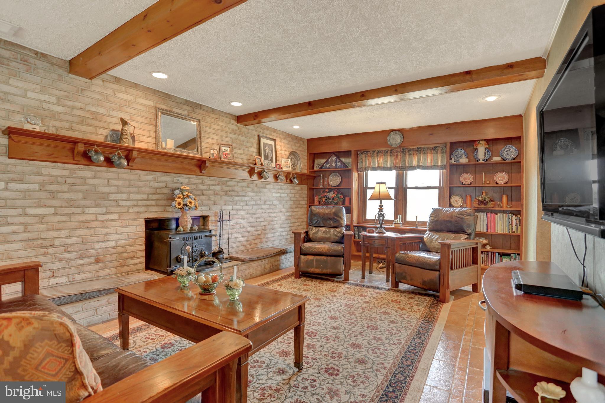 2301 Birch Road York, PA 17408 - Photo 5 of 40 a living room with fireplace furniture and a flat screen tv