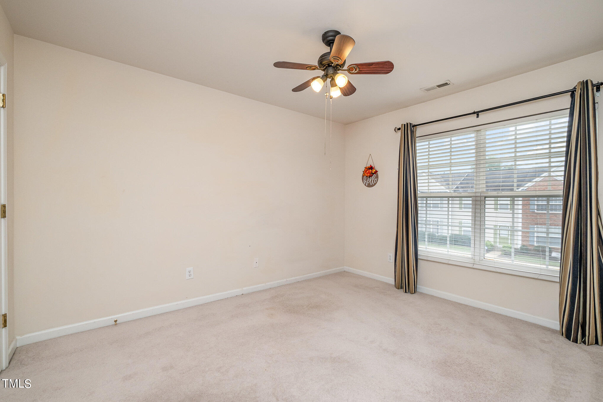 5121 Obion Court Raleigh, NC 27616 - Photo 11 of 13 a view of an empty room with a window