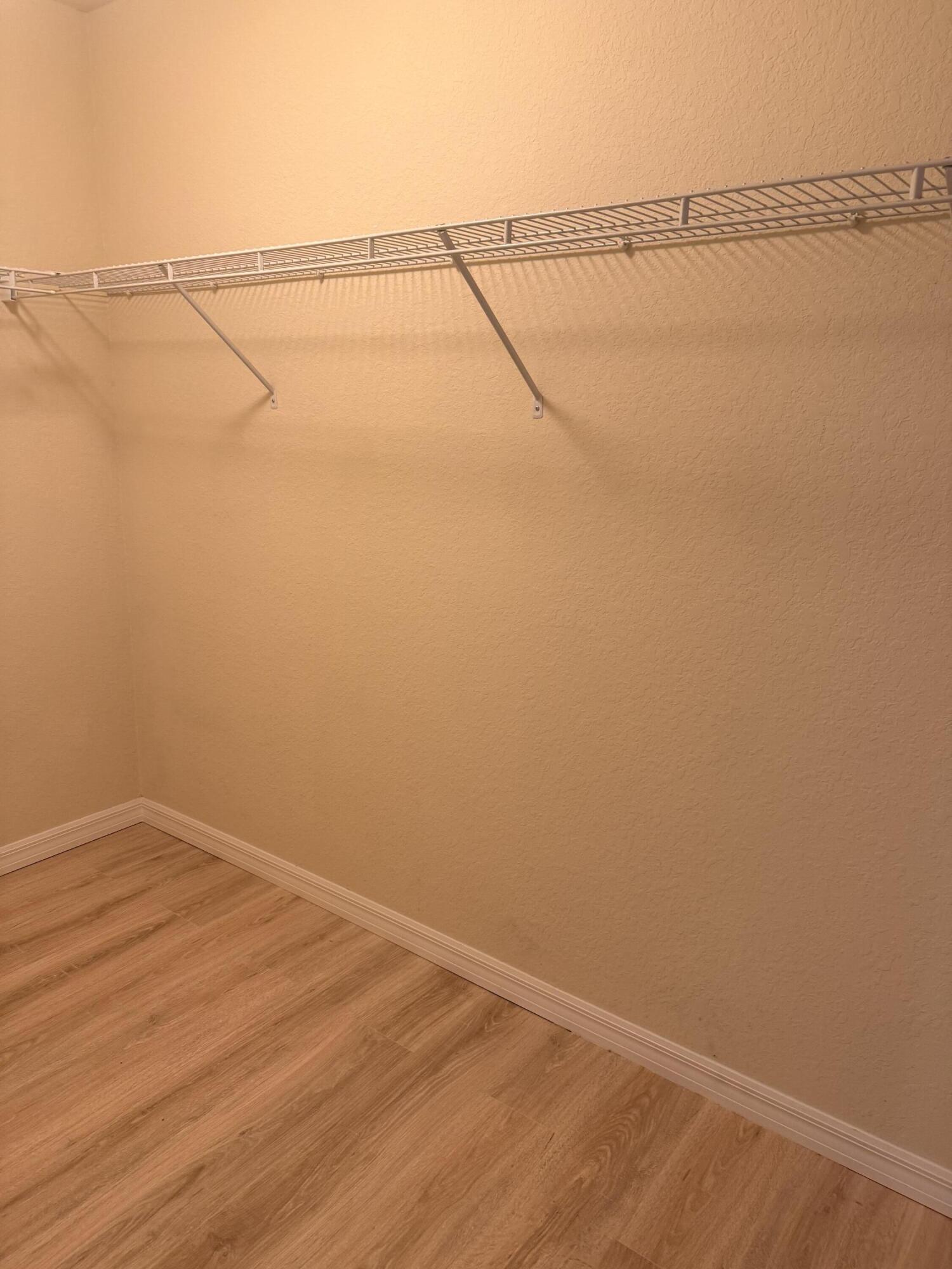 461 Southeast Bloxham Way Stuart, FL 34997 - Photo 11 of 17 Primary Closet