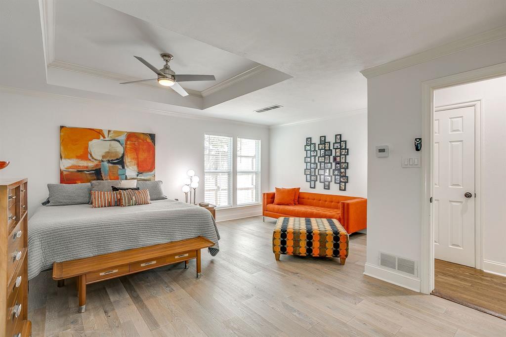 4304 Cobblers Lane Dallas, TX 75287 - Photo 13 of 31 a bedroom with furniture and wooden floor