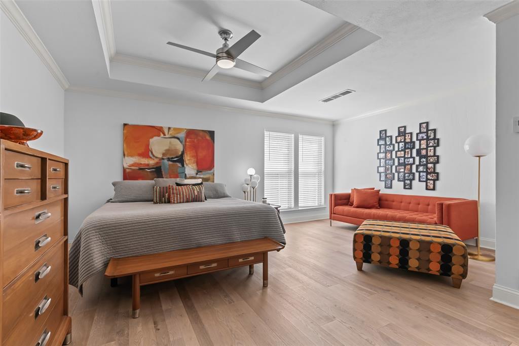 4304 Cobblers Lane Dallas, TX 75287 - Photo 15 of 31 a bedroom with a bed and wooden floor