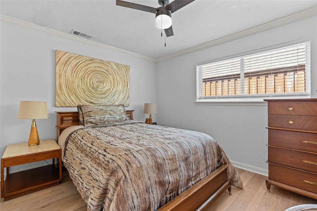 4304 Cobblers Lane Dallas, TX 75287 - Photo 21 of 31 a bedroom with a bed and a window