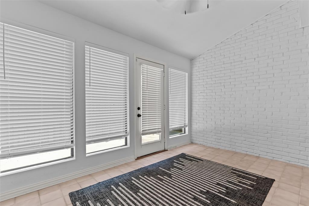 4304 Cobblers Lane Dallas, TX 75287 - Photo 23 of 31 a view of a room with wooden floor and a window