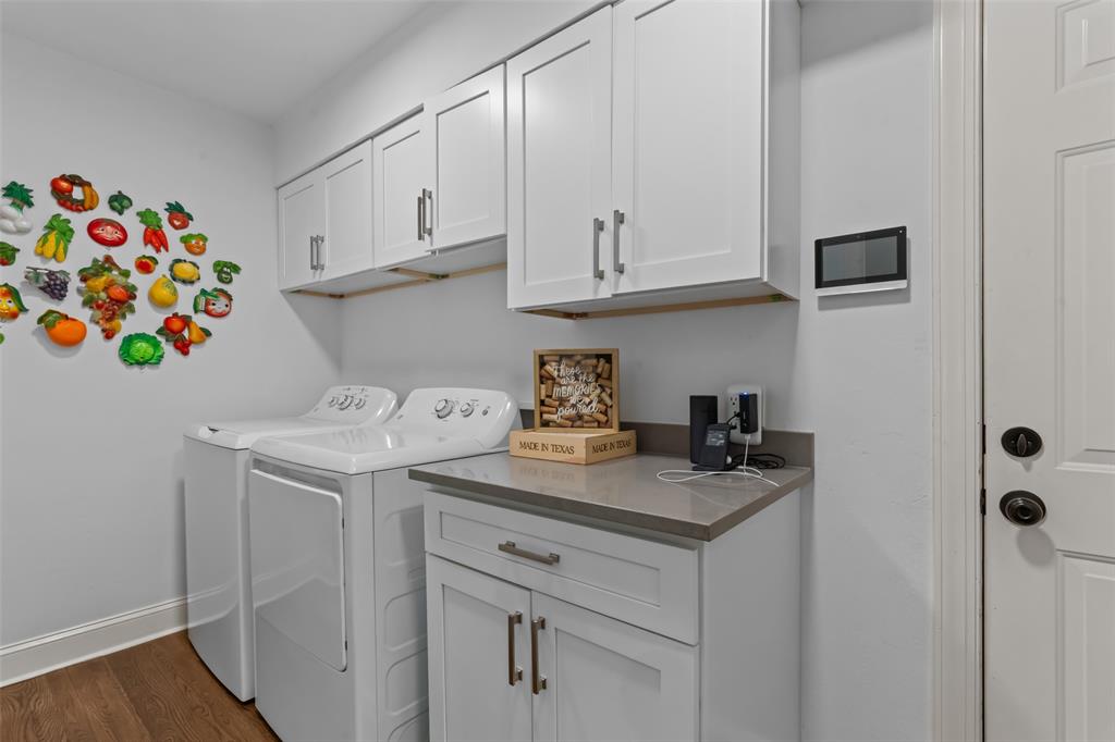 4304 Cobblers Lane Dallas, TX 75287 - Photo 24 of 31 a kitchen with a sink a stove and cabinets