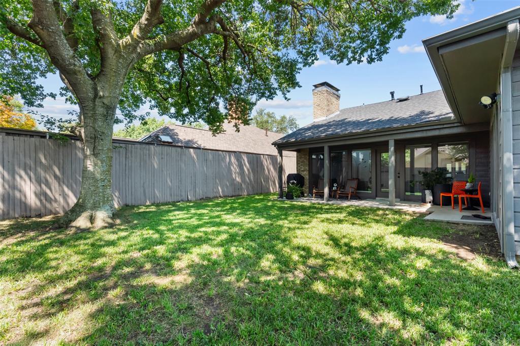 4304 Cobblers Lane Dallas, TX 75287 - Photo 26 of 31 a view of a house with a backyard and a patio