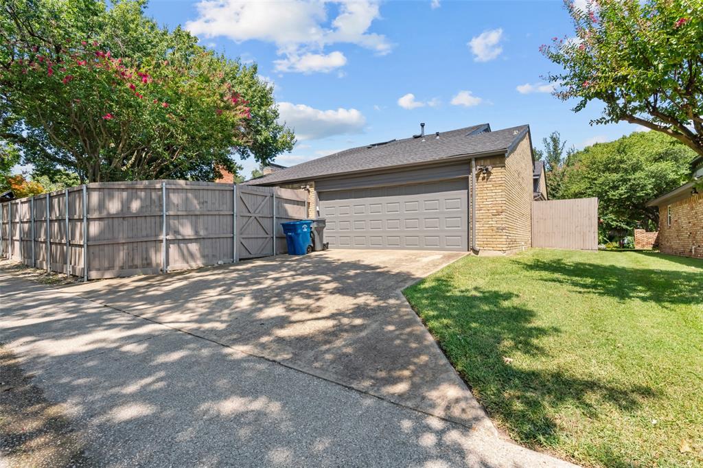 4304 Cobblers Lane Dallas, TX 75287 - Photo 30 of 31 a backyard of a house with a large tree