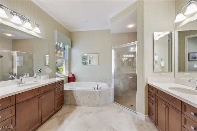 a bathroom with a sink a toilet a tub and shower