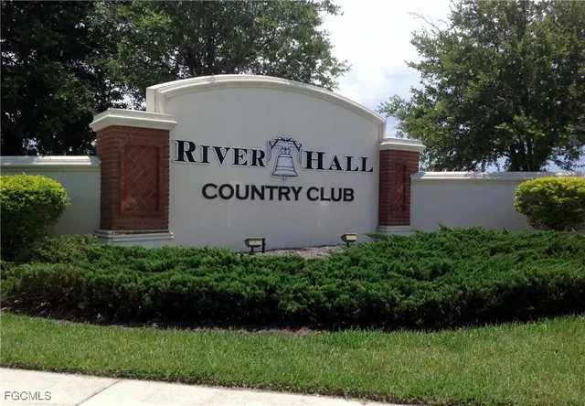 an aerial view of residential houses with outdoor space and lake view