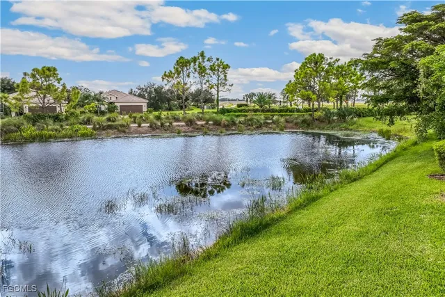 a view of a lake with a house in the background