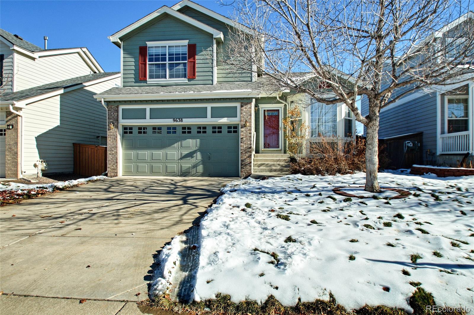 9638 Silverberry Circle Highlands Ranch, CO 80129 - Photo 1 of 27 a front view of a house with a yard