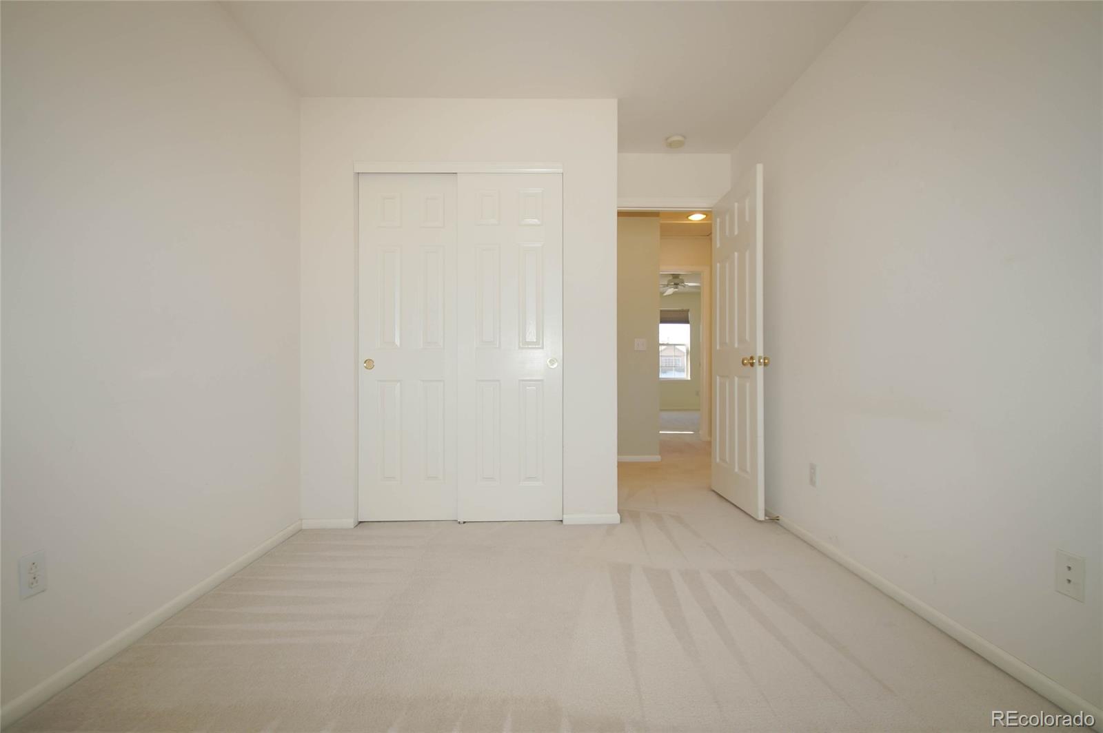 9638 Silverberry Circle Highlands Ranch, CO 80129 - Photo 15 of 27 an empty room with an entryway door