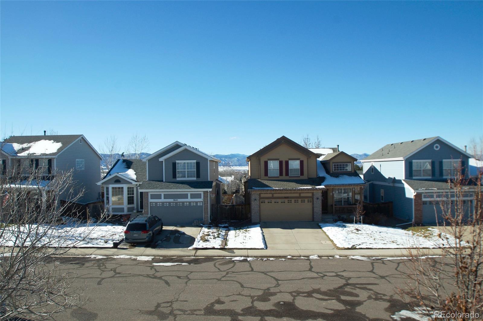 9638 Silverberry Circle Highlands Ranch, CO 80129 - Photo 25 of 27 a view of a house with a yard