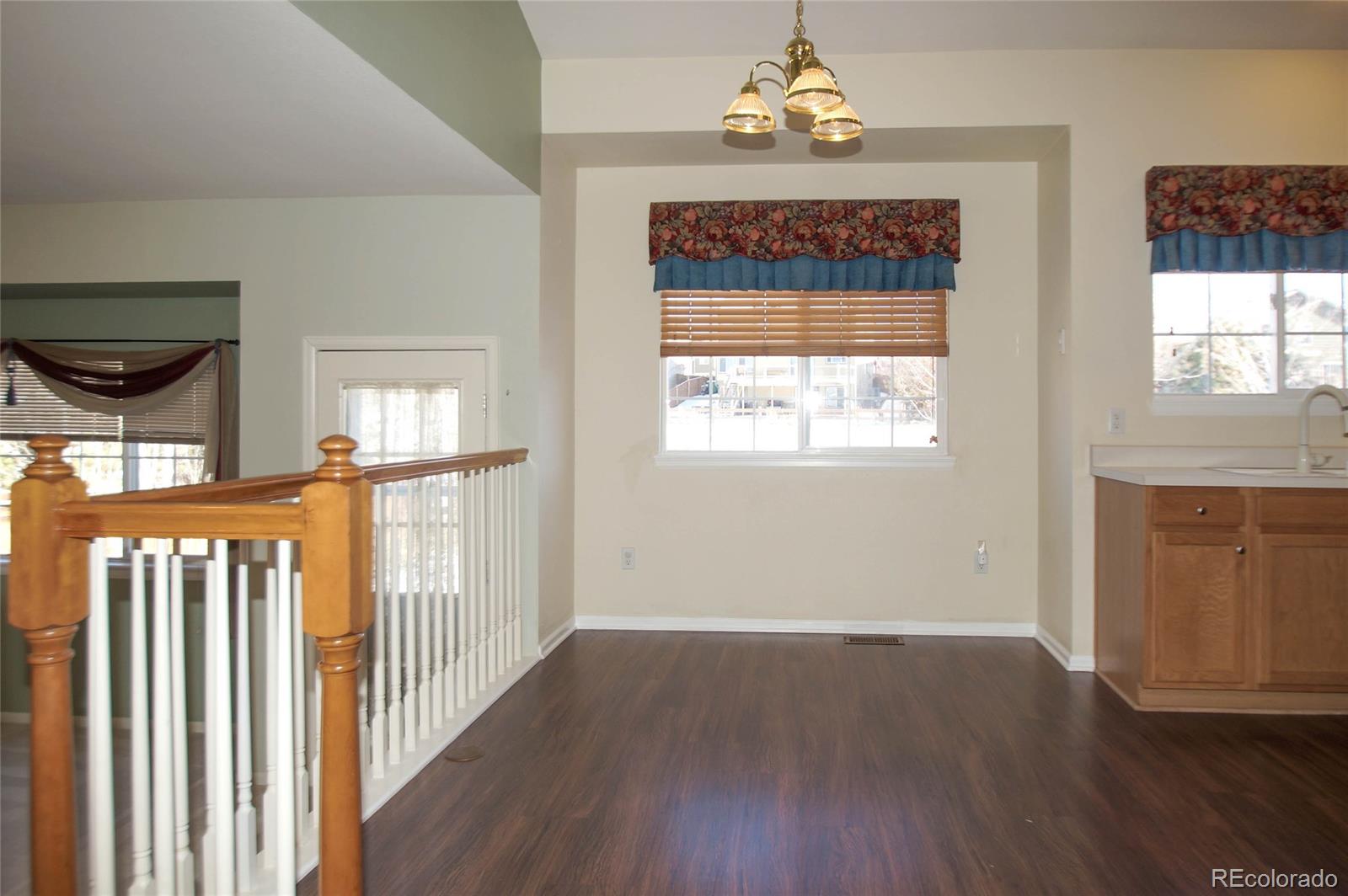 9638 Silverberry Circle Highlands Ranch, CO 80129 - Photo 5 of 27 a view of entryway with wooden floor