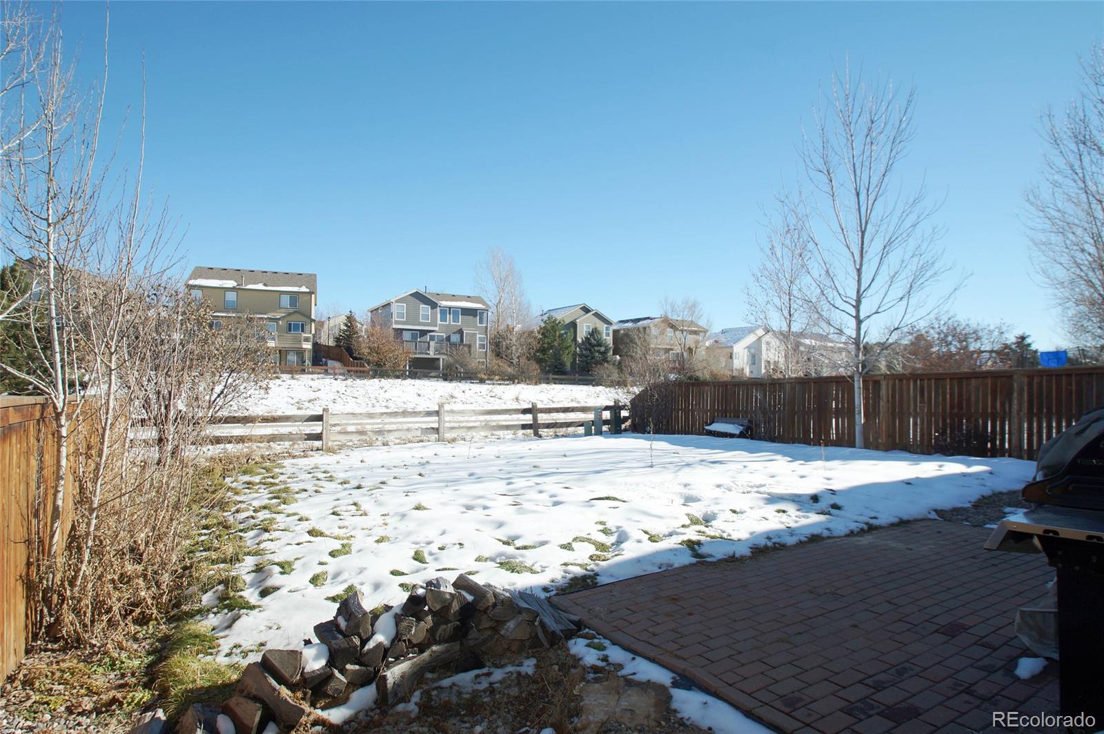 9638 Silverberry Circle Highlands Ranch, CO 80129 - Photo 7 of 27 a view of a yard with snow on the road