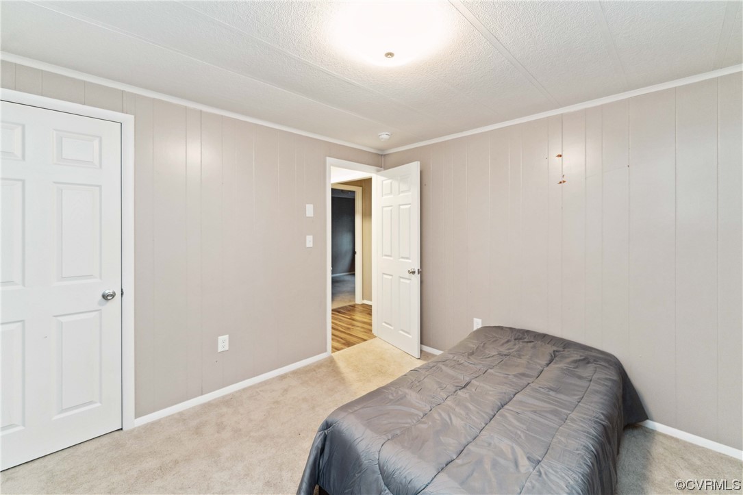 21511 Sappony Road Moseley, VA 23120 - Photo 14 of 25 a bedroom with a bed and a window