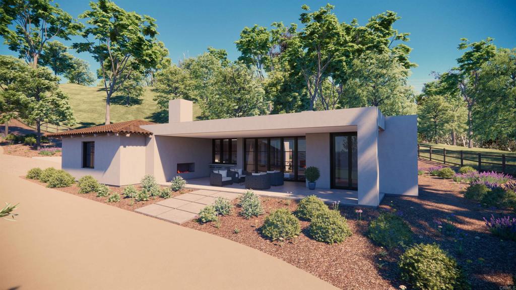 5501 Paseo Del Alba Rancho Santa Fe, CA 92067 - Photo 7 of 8 a front view of a house with a yard and outdoor seating