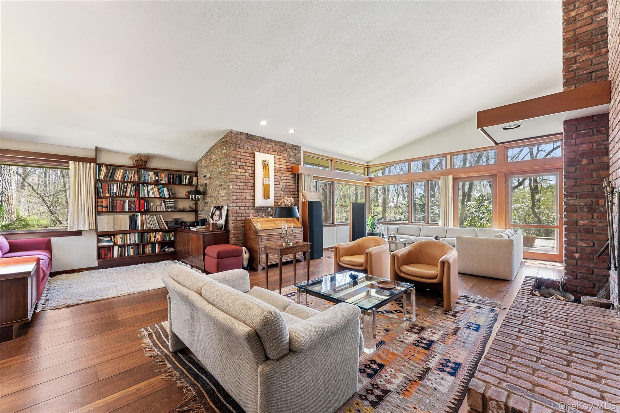98 Cushman Road Scarsdale, NY 10583 - Photo 5 of 43 a living room with furniture fireplace and a large window