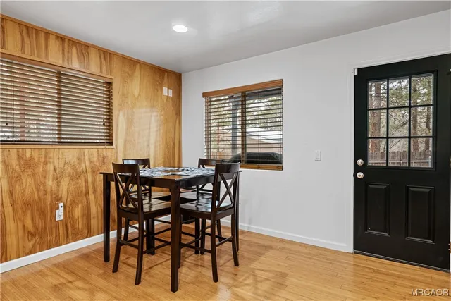 a view of a dining room with furniture and window