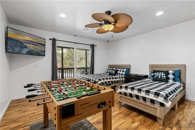 a bedroom with a bed and a large window