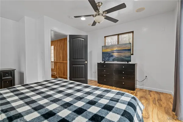 a bedroom with a bed and a dresser