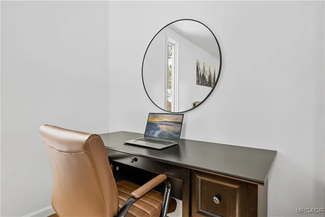 a room with a table and a mirror