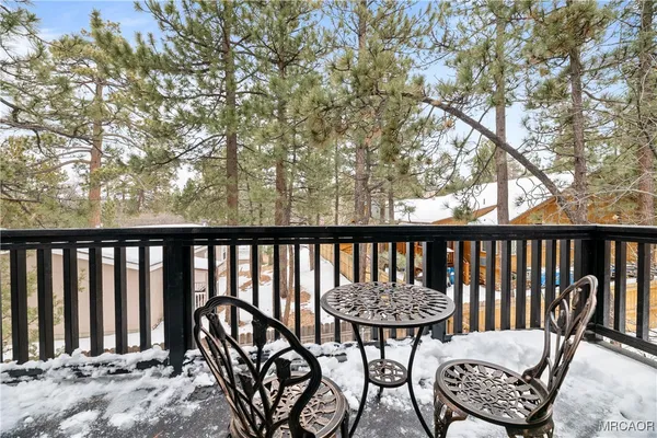 a view of balcony with wooden floor