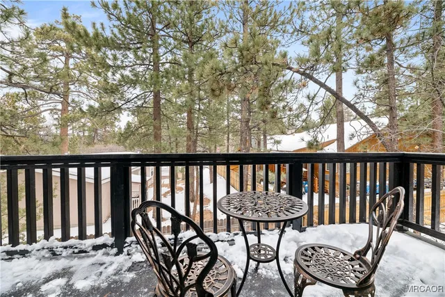 a view of balcony with wooden floor