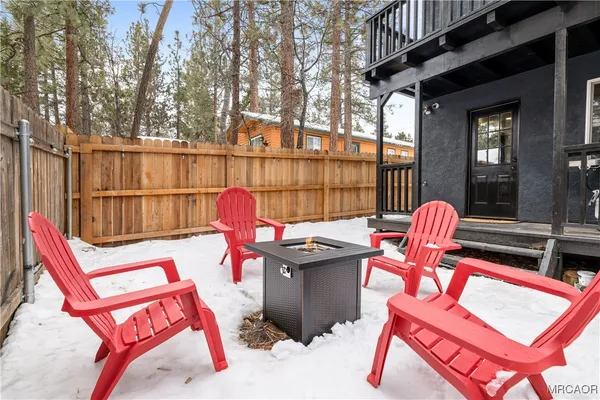 a view of a chairs and tables in the balcony