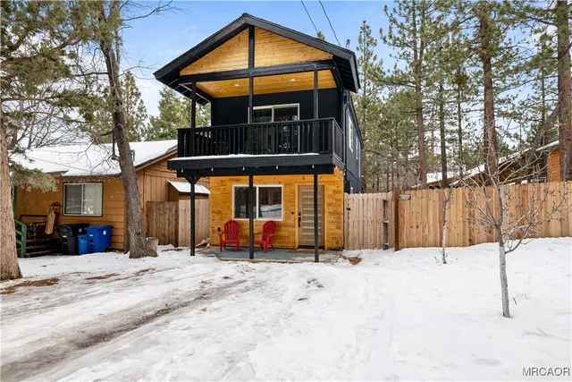 a view of a house with a snow on the road