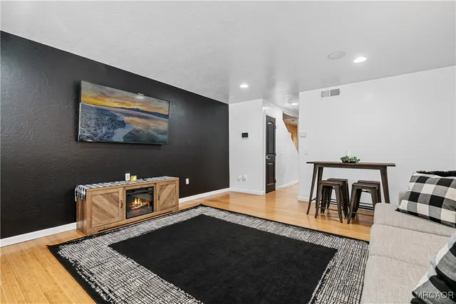 a living room with a rug