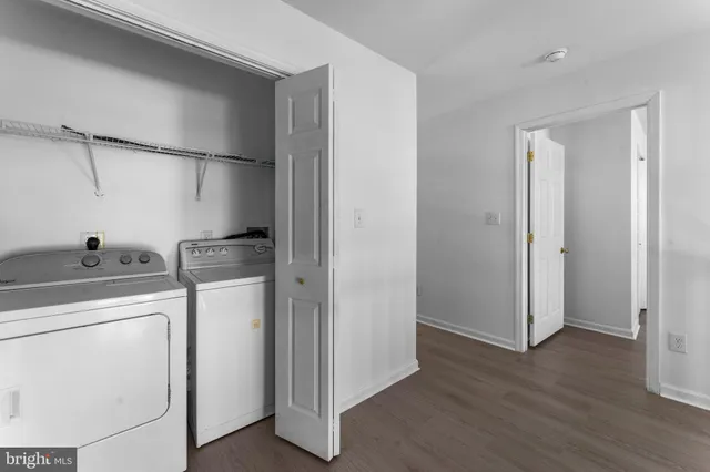 a view of hallway with wooden floor