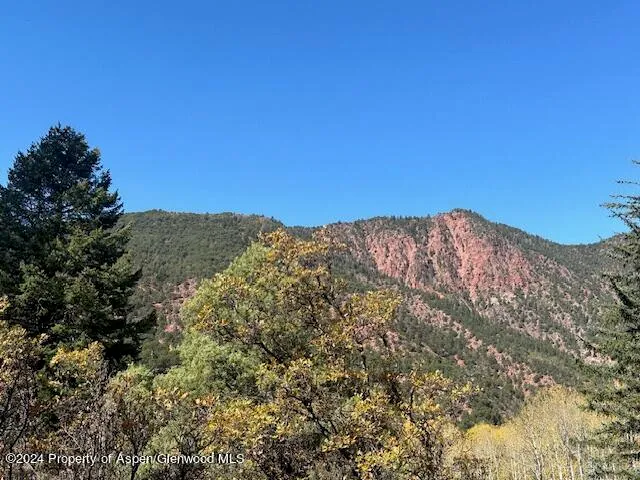 a view of mountain view with lots of trees