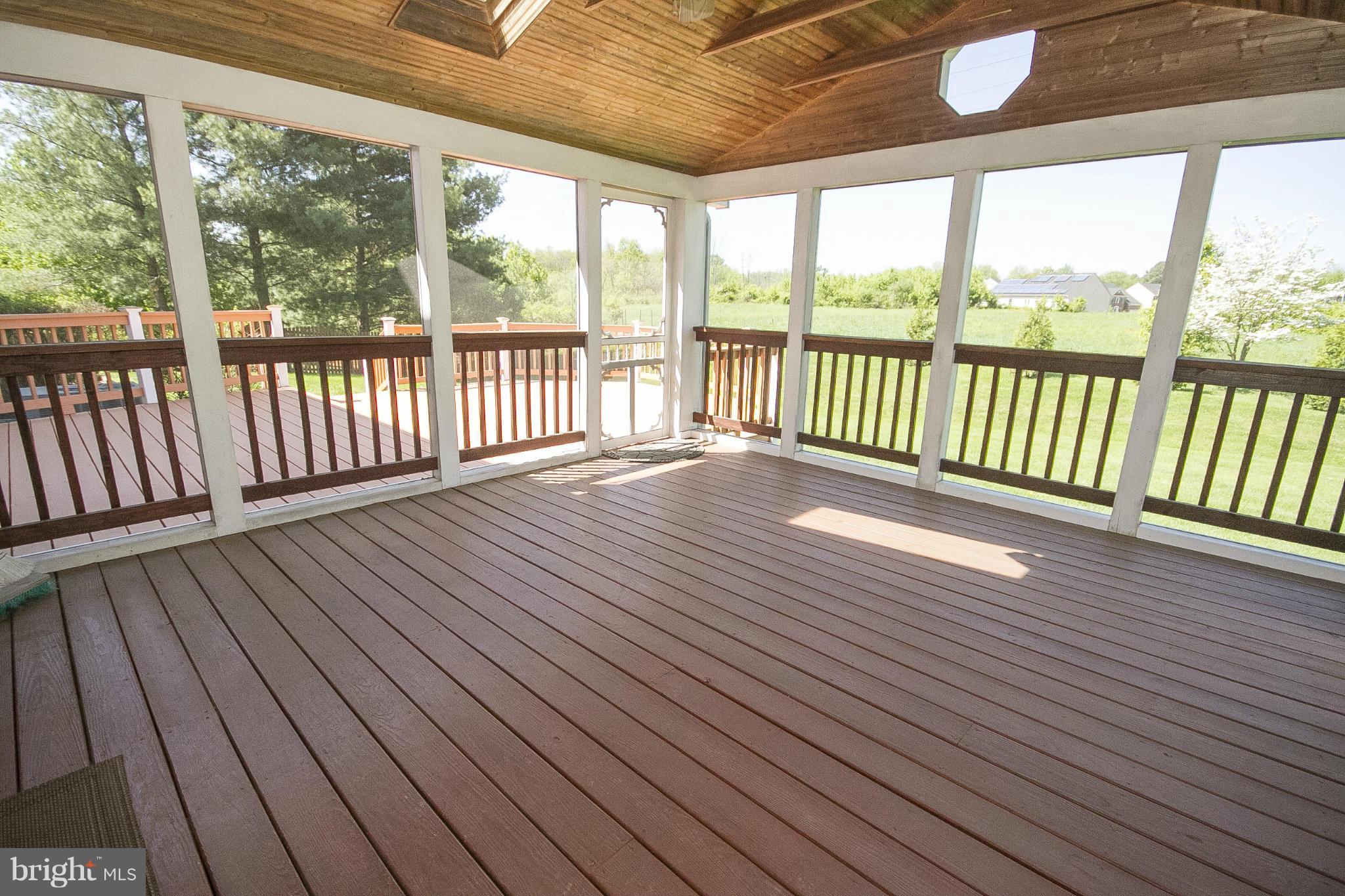 2680 Melba Road Ellicott City, MD 21042 - Photo 25 of 27 Screened porch looking towards large deck
