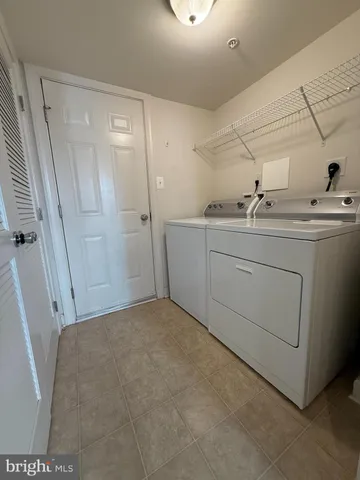 a room with a sink and a mirror