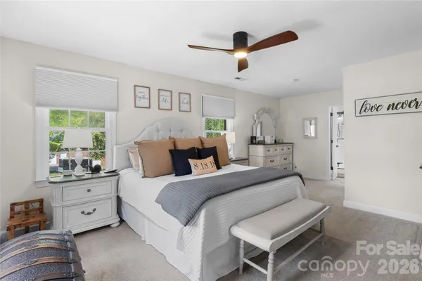 a bed room with a bed and a window
