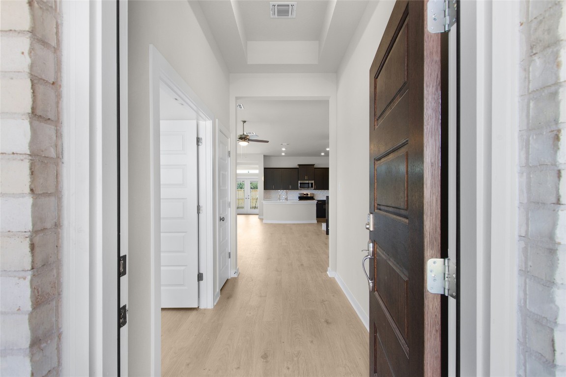 405 Raleigh Drive Georgetown, TX 78633 - Photo 18 of 36 a view of a kitchen from the hallway