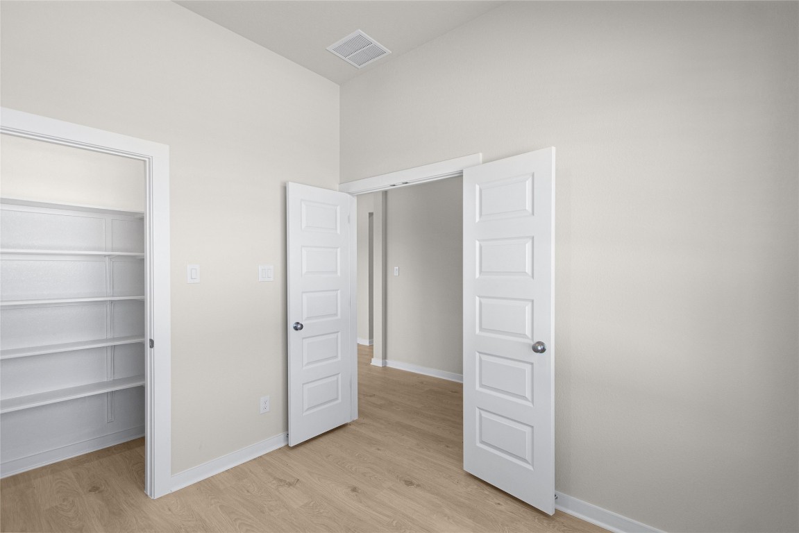 405 Raleigh Drive Georgetown, TX 78633 - Photo 21 of 36 a view of an empty walk in closet