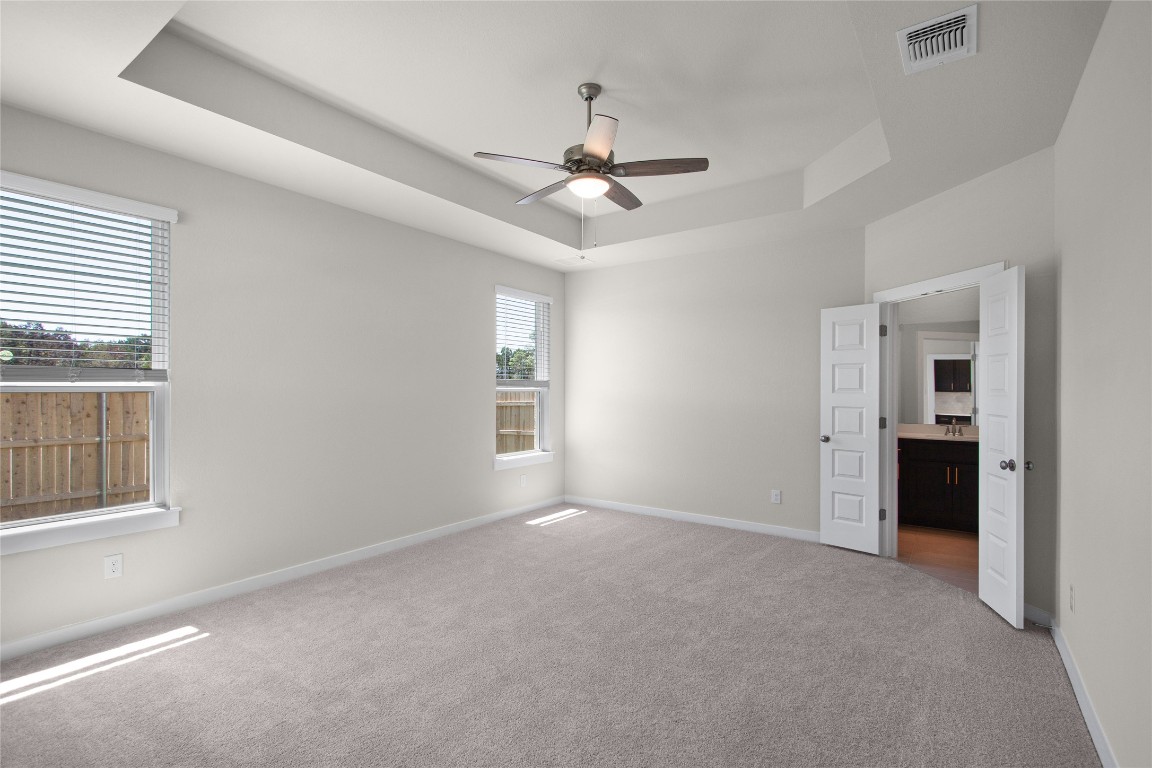 405 Raleigh Drive Georgetown, TX 78633 - Photo 27 of 36 an empty room with windows and fan