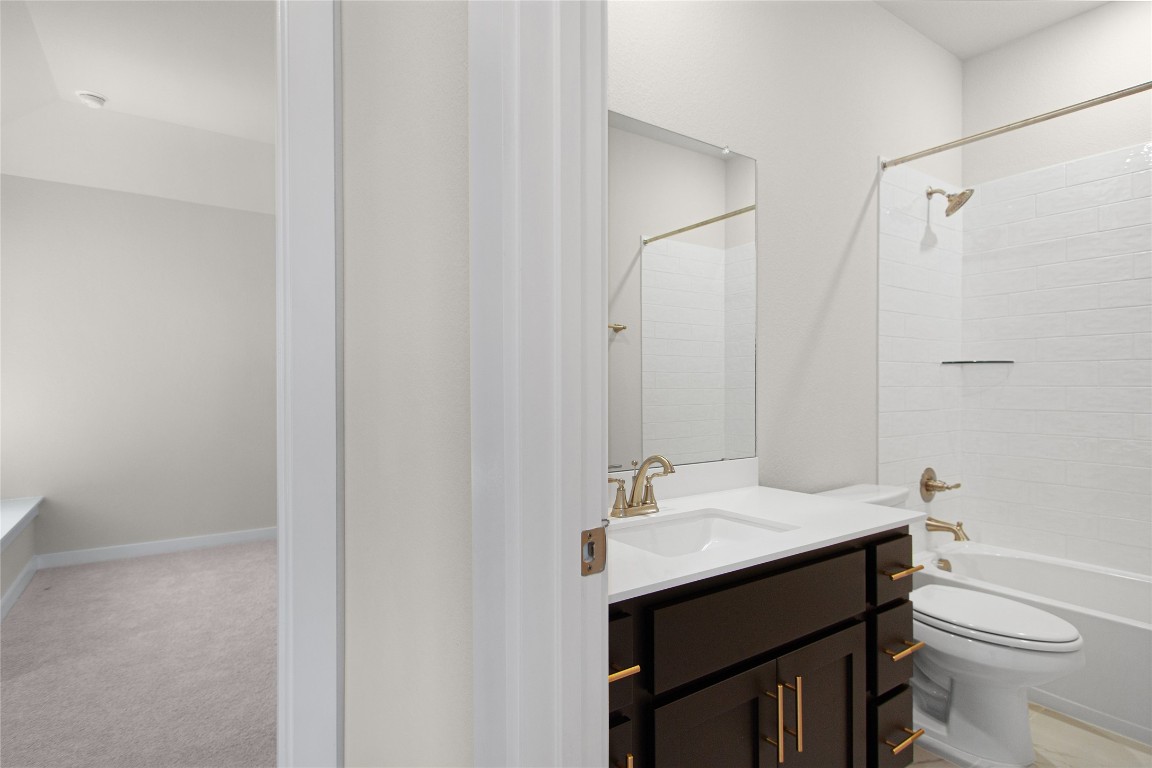 405 Raleigh Drive Georgetown, TX 78633 - Photo 33 of 36 a bathroom with a sink a toilet and shower