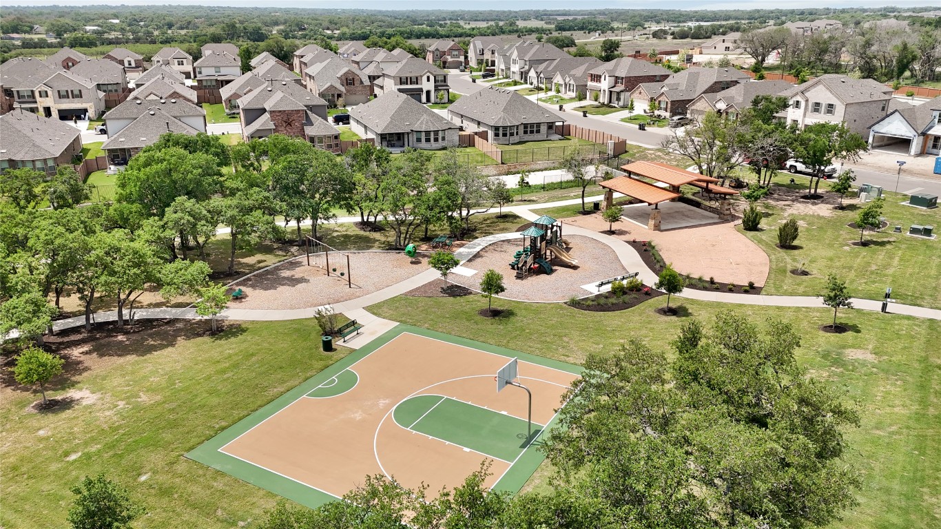 405 Raleigh Drive Georgetown, TX 78633 - Photo 9 of 36 an aerial view of residential houses with outdoor space and trees