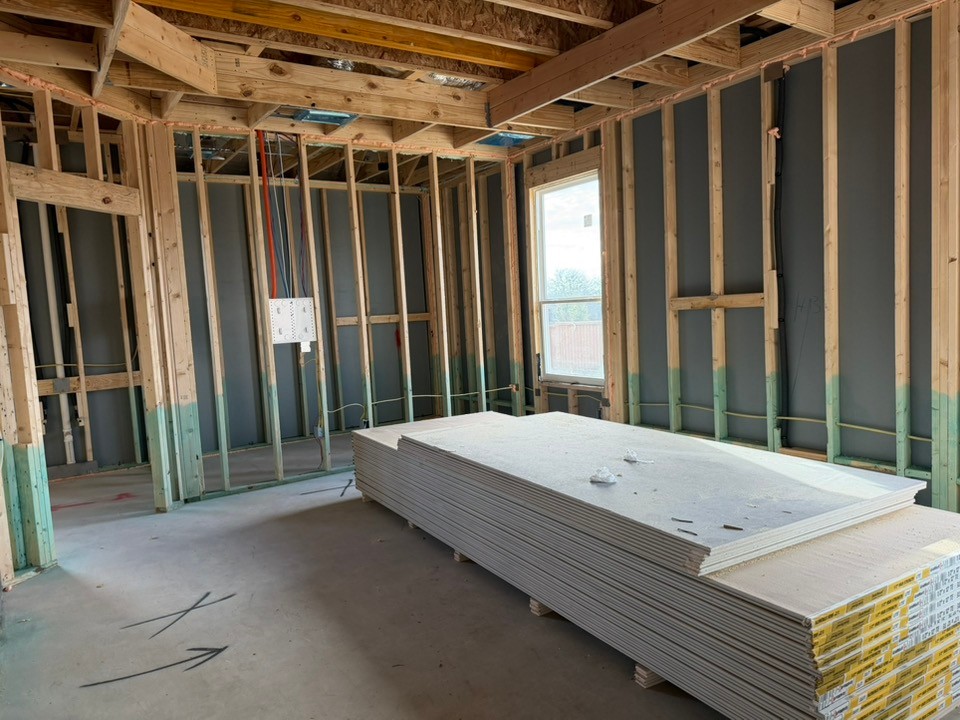 405 Raleigh Drive Georgetown, TX 78633 - Photo 4 of 36 a bed sitting in front of a door