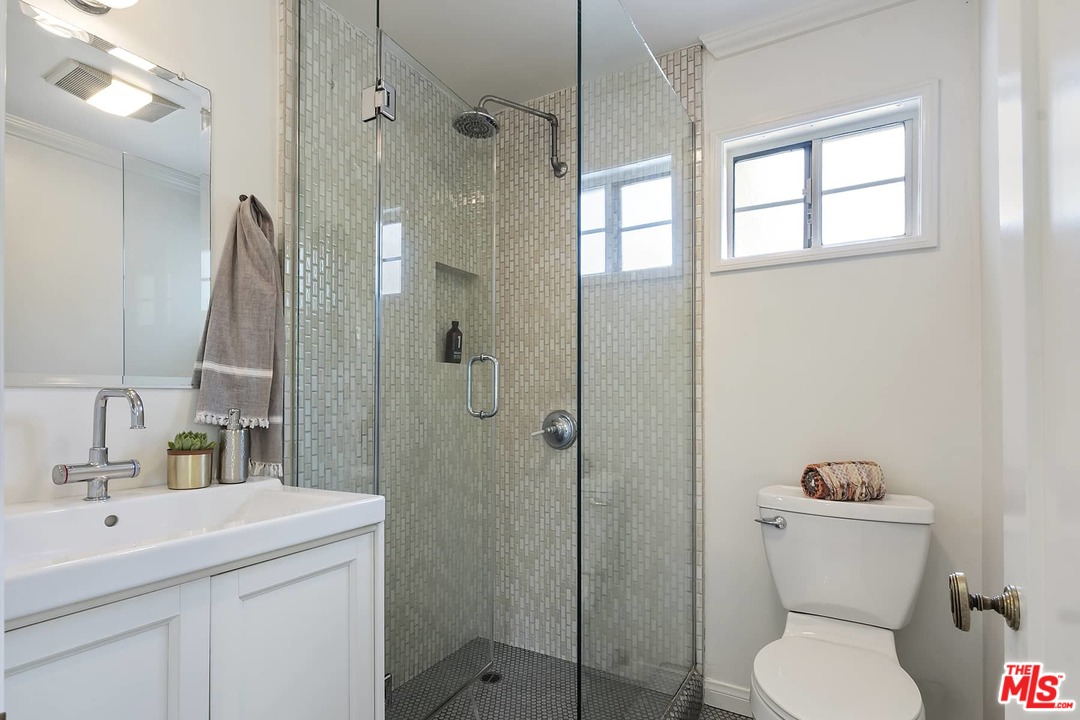 2801 West Silver Drive Los Angeles, CA 90039 - Photo 13 of 34 a bathroom with a toilet sink vanity and shower