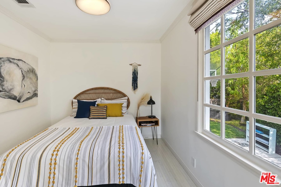 2801 West Silver Drive Los Angeles, CA 90039 - Photo 14 of 34 a bedroom with a bed and a large window