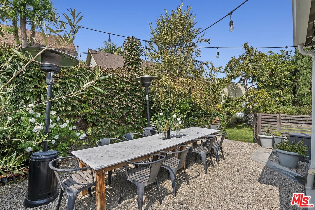 2801 West Silver Drive Los Angeles, CA 90039 - Photo 23 of 34 a view of a patio with table and chairs and potted plants