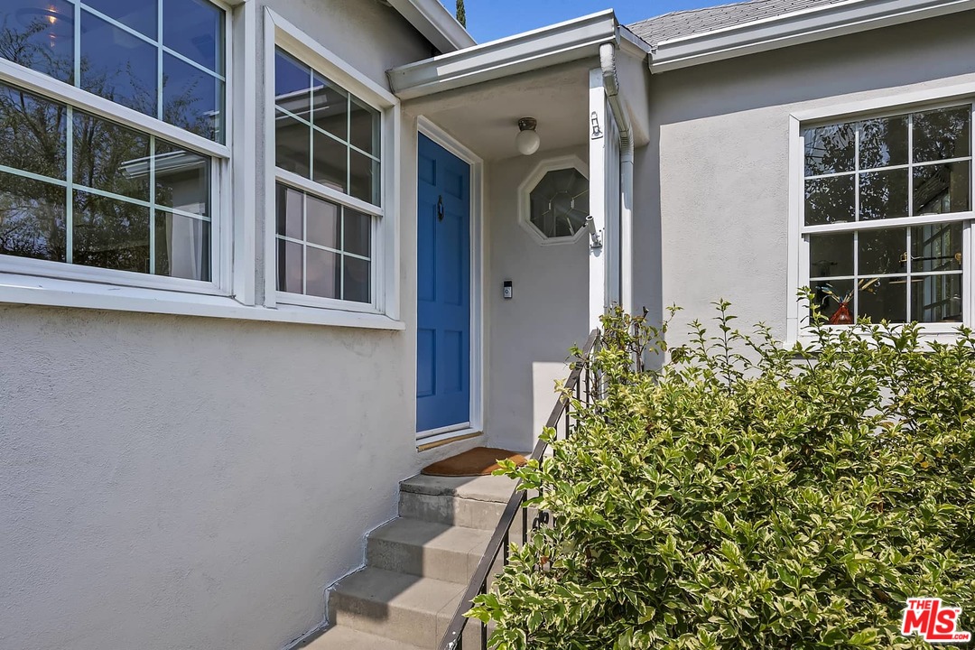 2801 West Silver Drive Los Angeles, CA 90039 - Photo 4 of 34 a view of a house with a potted plant and windows