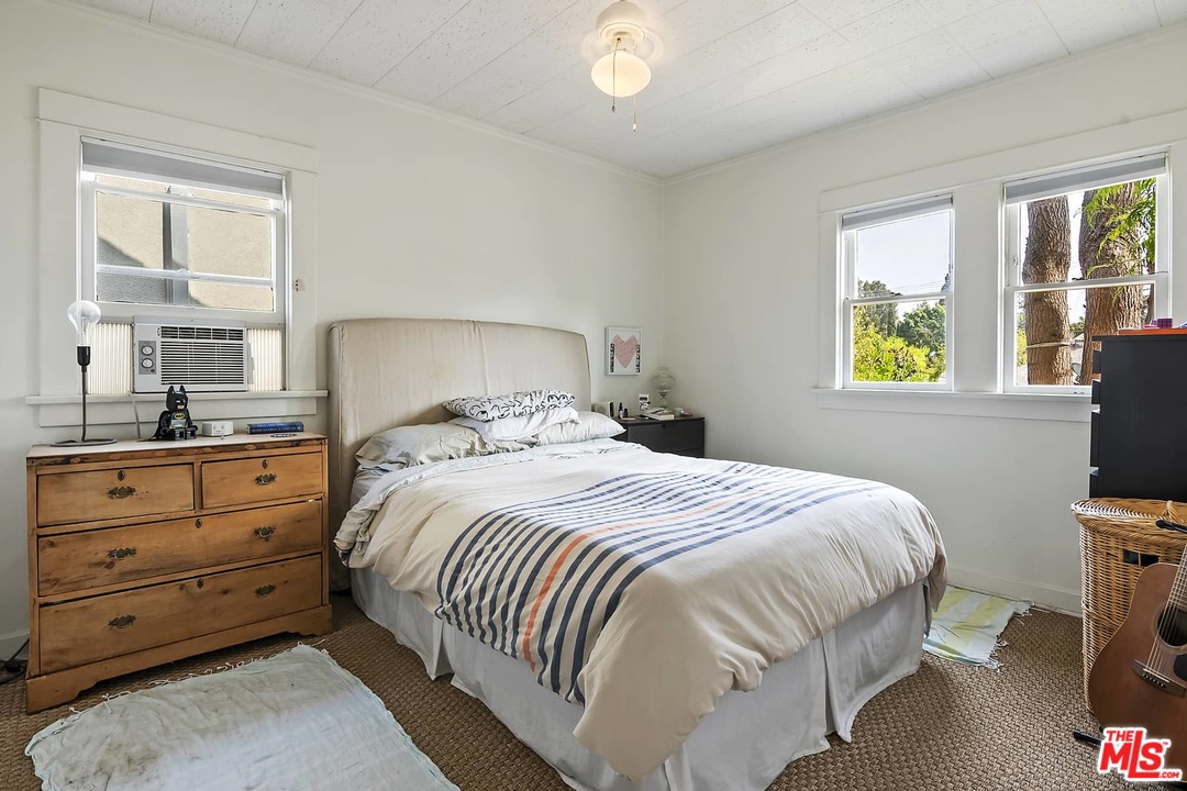 2801 West Silver Drive Los Angeles, CA 90039 - Photo 32 of 34 a bedroom with a bed and windows